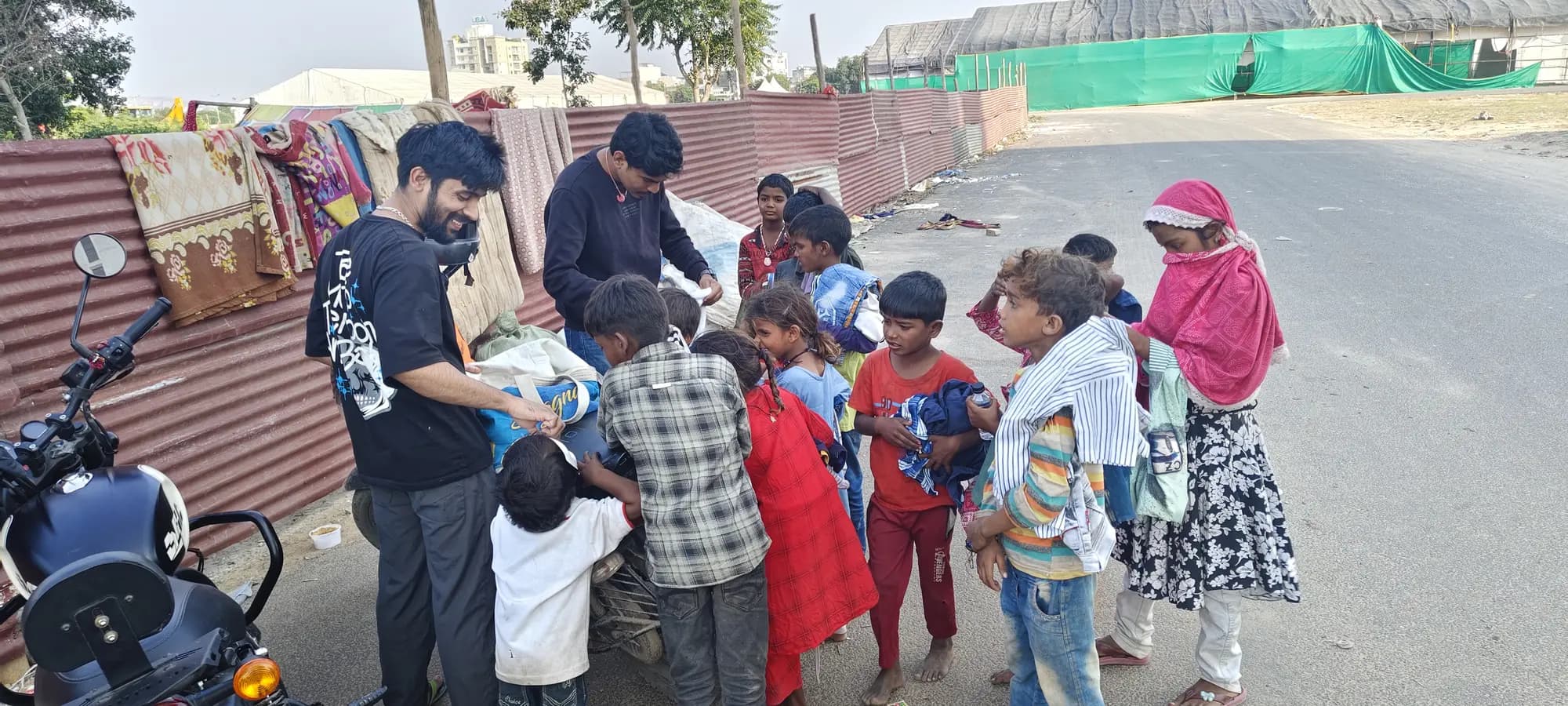 Foundation volunteers and community members during a clothing-support handover in Jaipur.