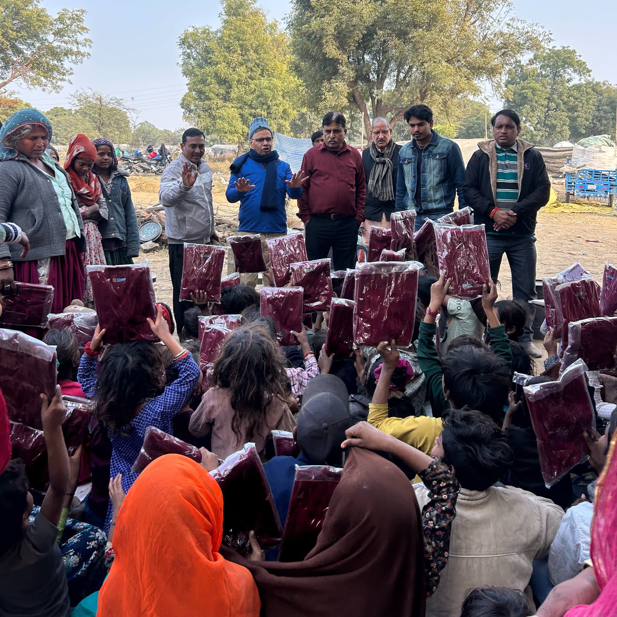 Children and families gathered during a winter dignity support activity.